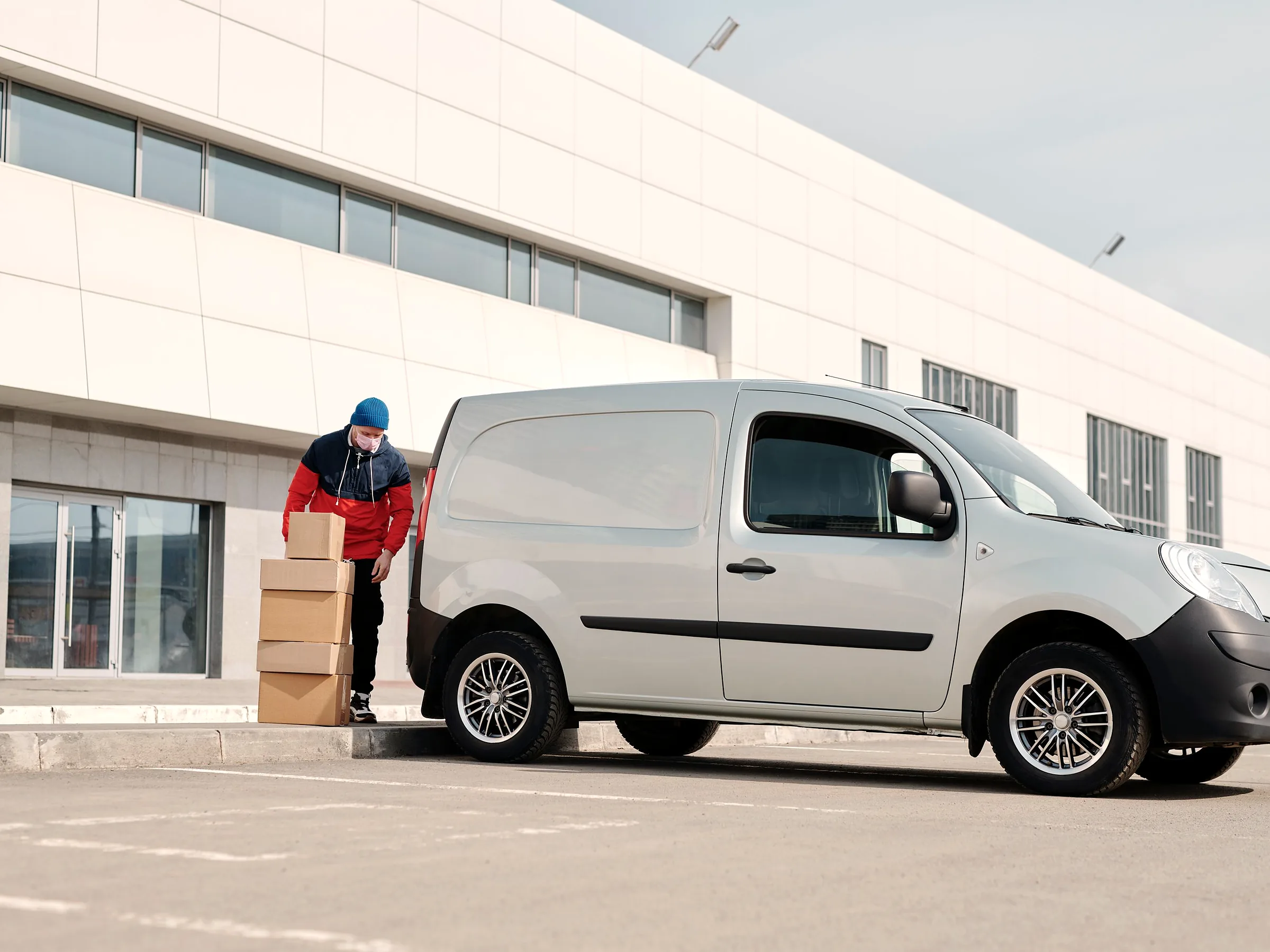 Delivery van being loaded with corrugated shipping boxes